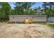 Home with wood siding, brick foundation, and a wood staircase leading to a door at 413 Peacock Ln, Summerville, SC 29486