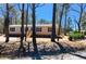 Charming single-story home featuring tan siding, dark shutters, and a wooden staircase leading to the front door at 413 Peacock Ln, Summerville, SC 29486