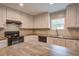 Newly updated kitchen featuring a center island, modern appliances, ample cabinet space, and sleek countertops at 413 Peacock Ln, Summerville, SC 29486