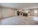 Open-concept living space showcasing plush carpet, a modern kitchen with an island, and an abundance of natural light at 413 Peacock Ln, Summerville, SC 29486