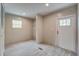 Bright room with wood-look floors, a window, and a white door at 413 Peacock Ln, Summerville, SC 29486
