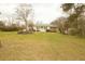 Expansive backyard view, showcasing the home's exterior and natural surroundings at 424 Salley Ackerman Dr, Cottageville, SC 29435