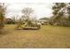 View of a large backyard with grassy area, a dilapidated deck and a single story house at 424 Salley Ackerman Dr, Cottageville, SC 29435