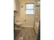 Full bath displays a toilet, window, bathtub, and shower with neutral paint at 424 Salley Ackerman Dr, Cottageville, SC 29435