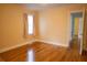 Bedroom boasts hardwood floors, a window, and access to other rooms at 424 Salley Ackerman Dr, Cottageville, SC 29435