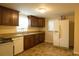 Efficient kitchen featuring granite countertops, brown cabinets and white appliances at 424 Salley Ackerman Dr, Cottageville, SC 29435