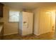 Eat-in kitchen shows large white refrigerator, window, and entry to another room at 424 Salley Ackerman Dr, Cottageville, SC 29435