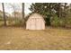 Exterior shot of a painted shed in the backyard on a grassy lot ready for storage at 424 Salley Ackerman Dr, Cottageville, SC 29435