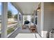 Cozy screened-in porch with comfortable seating, offering an ideal spot for outdoor relaxation and entertaining at 4603 Scout Aly, North Charleston, SC 29405