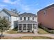 Home's backyard featuring a screened porch, manicured landscaping, and tranquil setting at 4603 Scout Aly, North Charleston, SC 29405