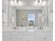 Bathroom featuring double sinks and a large mirror, providing convenience and style at 4603 Scout Aly, North Charleston, SC 29405