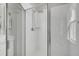 Bright bathroom featuring a glass enclosed shower with white subway tile and rainfall shower head at 4603 Scout Aly, North Charleston, SC 29405