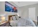 Cozy bedroom with a neutral color scheme, soft lighting, and unique mountain wall art at 4603 Scout Aly, North Charleston, SC 29405