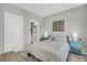 A calming bedroom featuring neutral walls, wood accents, and an en-suite bathroom at 4603 Scout Aly, North Charleston, SC 29405