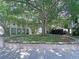 Beautiful community area featuring mature trees and residences, providing a serene and inviting atmosphere for residents at 4603 Scout Aly, North Charleston, SC 29405