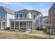 Inviting two-story home showcasing a large screened-in porch, enhancing outdoor living at 4603 Scout Aly, North Charleston, SC 29405