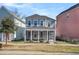 Beautiful two-story home boasts a large screened-in front porch for relaxing and entertaining at 4603 Scout Aly, North Charleston, SC 29405