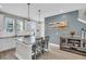 Bright kitchen island with modern pendant lighting, stainless steel sink and ample countertop space at 4603 Scout Aly, North Charleston, SC 29405