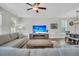 Bright and airy living room features a cozy fireplace, hardwood floors, and neutral decor at 4603 Scout Aly, North Charleston, SC 29405