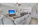 Open-concept living room, dining, and kitchen featuring modern finishes and hardwood floors at 4603 Scout Aly, North Charleston, SC 29405