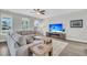 Spacious living room showcases hardwood floors, a fireplace, and ample natural light at 4603 Scout Aly, North Charleston, SC 29405