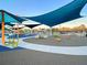 Colorful playground with swings, playhouses, and spring riders, all under the shade of modern blue canopies at 4603 Scout Aly, North Charleston, SC 29405