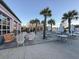 Outdoor dining area surrounded by palm trees and modern decor at 4603 Scout Aly, North Charleston, SC 29405