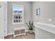 Bright sitting area with a storage bench, window overlooking neighborhood, and decorative plant at 4603 Scout Aly, North Charleston, SC 29405