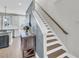 Inviting staircase with hardwood treads, white risers, and a wooden handrail at 4603 Scout Aly, North Charleston, SC 29405