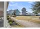 Community street view with colorful homes, walking path, and landscaping at 4603 Scout Aly, North Charleston, SC 29405