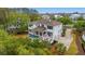 Aerial view of the home showcasing a covered patio, pool, spa, and large driveway at 4874 Sound View Dr, Mount Pleasant, SC 29466