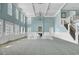 Expansive ballroom with high ceilings, elegant chandeliers, light blue walls, and staircase at 4874 Sound View Dr, Mount Pleasant, SC 29466