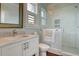 Chic bathroom featuring a marble vanity, a modern shower, and bright natural light enhancing its elegant design at 4874 Sound View Dr, Mount Pleasant, SC 29466
