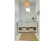 Stylish bathroom featuring a marble vanity, a round mirror, and decorative lighting for a luxurious and inviting space at 4874 Sound View Dr, Mount Pleasant, SC 29466