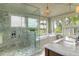 This bathroom features a separate glass shower and a soaking tub with scenic outdoor views at 4874 Sound View Dr, Mount Pleasant, SC 29466