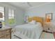 Inviting bedroom featuring natural light, modern shutters, and chic decor for a serene and stylish retreat at 4874 Sound View Dr, Mount Pleasant, SC 29466