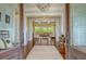 Inviting foyer with hardwood floors, view into living area, and warm, neutral tones at 4874 Sound View Dr, Mount Pleasant, SC 29466