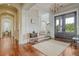 Inviting foyer with hardwood floors, staircase, elegant lighting, and a view to the home's exterior at 4874 Sound View Dr, Mount Pleasant, SC 29466