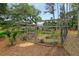A fenced garden with raised beds and pea gravel provides a safe and enjoyable outdoor space at 4874 Sound View Dr, Mount Pleasant, SC 29466