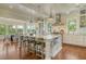 Spacious kitchen with a large island, stainless steel appliances, and an adjoining dining area with great views at 4874 Sound View Dr, Mount Pleasant, SC 29466