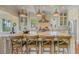 Large kitchen island with marble countertop, seating, pendant lights, and stainless steel appliances at 4874 Sound View Dr, Mount Pleasant, SC 29466
