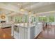 Bright, open kitchen with a marble island and stainless steel appliances adjacent to the living area at 4874 Sound View Dr, Mount Pleasant, SC 29466
