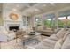 Cozy living room with fireplace, built-in bookshelves, and comfortable seating arrangement at 4874 Sound View Dr, Mount Pleasant, SC 29466