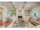 Cozy living room featuring a brick fireplace, built-in shelving, and comfortable seating arrangements at 4874 Sound View Dr, Mount Pleasant, SC 29466