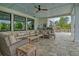 Inviting covered patio with cozy seating, a built-in grill, and an outdoor dining area at 4874 Sound View Dr, Mount Pleasant, SC 29466