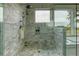 The shower offers a rain shower head, a built in seat, and a storage nook for bath products at 4874 Sound View Dr, Mount Pleasant, SC 29466