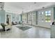 Cozy sitting area featuring tile flooring, elegant chandelier, and natural light at 4874 Sound View Dr, Mount Pleasant, SC 29466