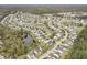 Aerial view of a suburban community with homes surrounding ponds and green spaces at 4987 Ballantine Dr, Summerville, SC 29485