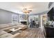 A spacious living room featuring gray walls, fireplace, modern flooring and plenty of natural light at 4987 Ballantine Dr, Summerville, SC 29485