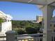 Scenic balcony view featuring lush greenery, distant buildings, and clear blue skies at 5009 Old Bridgeview Ln # 5009, Charleston, SC 29403